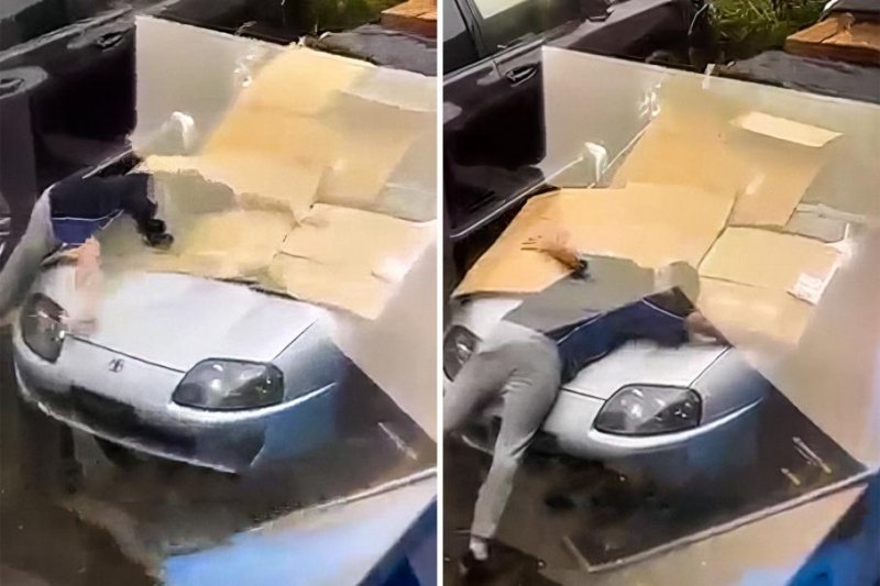 Видео: владелец Toyota Supra защищает спорткар от града своим телом